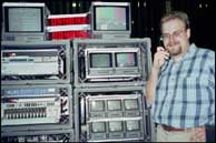 Ben poses in front of the transmission racks